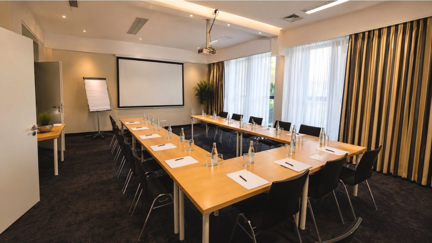 Conference room setup with seating and warm lighting.